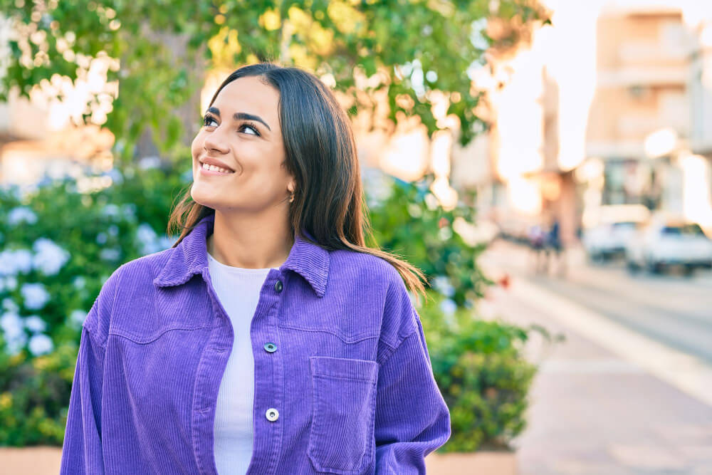 Young woman smiling outdoors